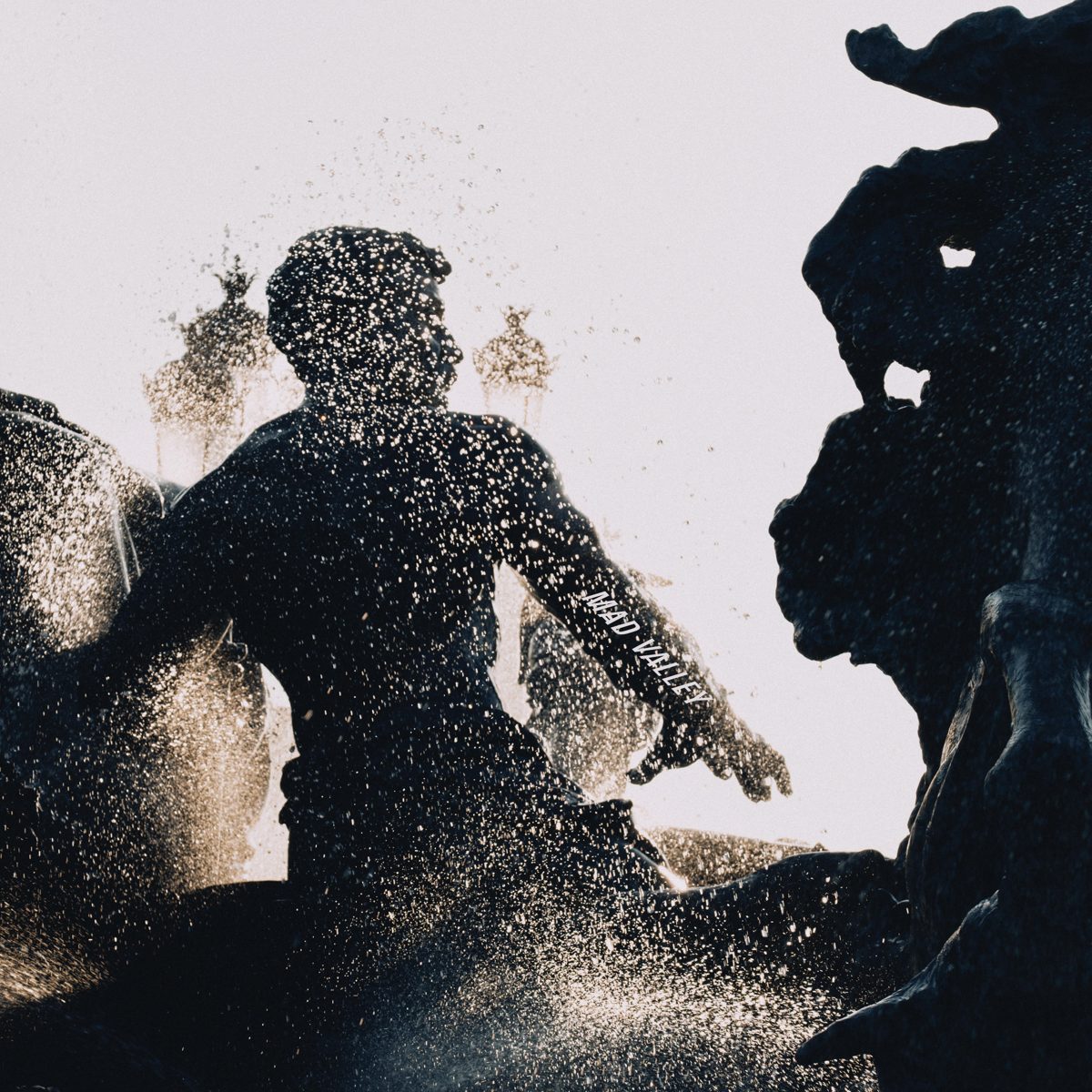 Mad Valley album cover — fountain statues in spray